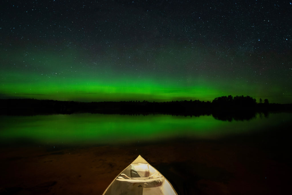 Northern lights reflecting in Plum Lake