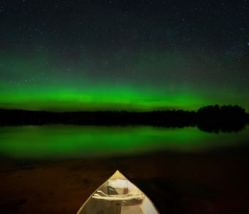 Northern lights reflecting in Plum Lake